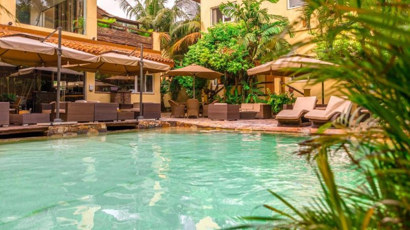 Courtyard swimming pool and wooden sun deck at Somewhere Nice hostel in Accra Ghana